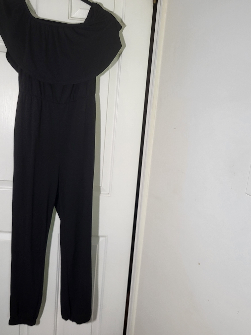 Off-the-Shoulder Black Jumpsuit with Ruffle Neckline